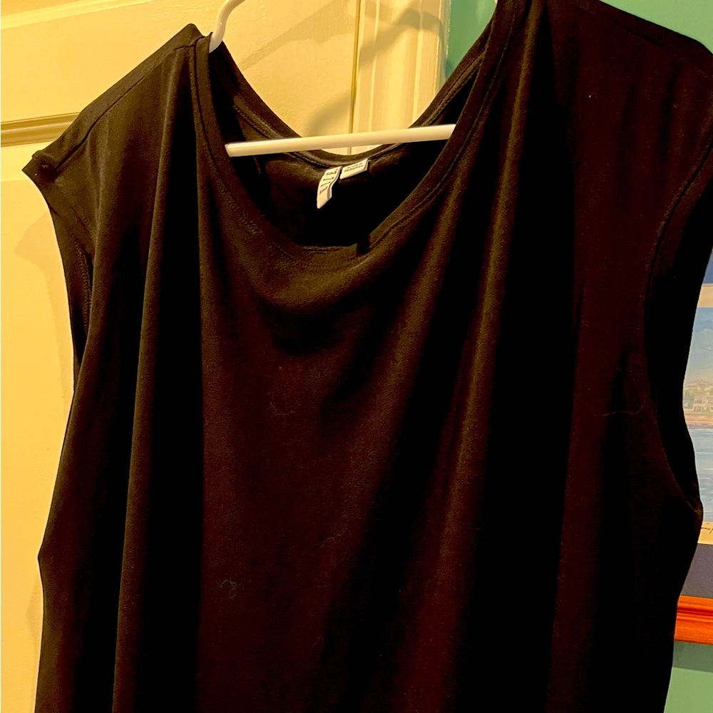 Sleeveless black top with white detailed hem